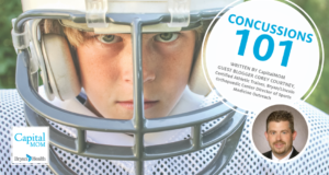 Young boy in gear at football practice