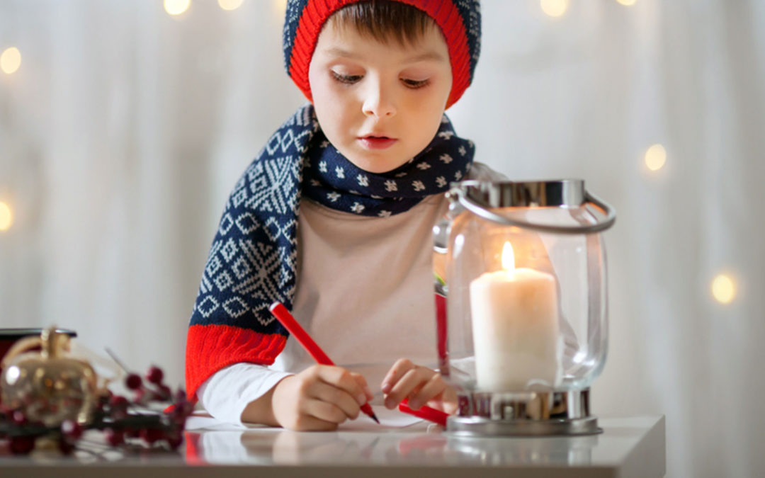 little boy writing Christmas list