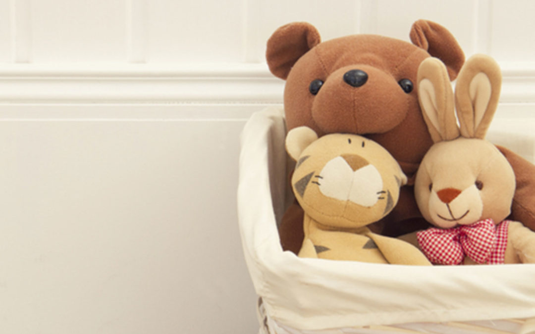 children's stuffed animals in basket
