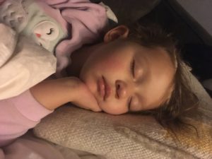 Mallory's daughter sleeping in their bed