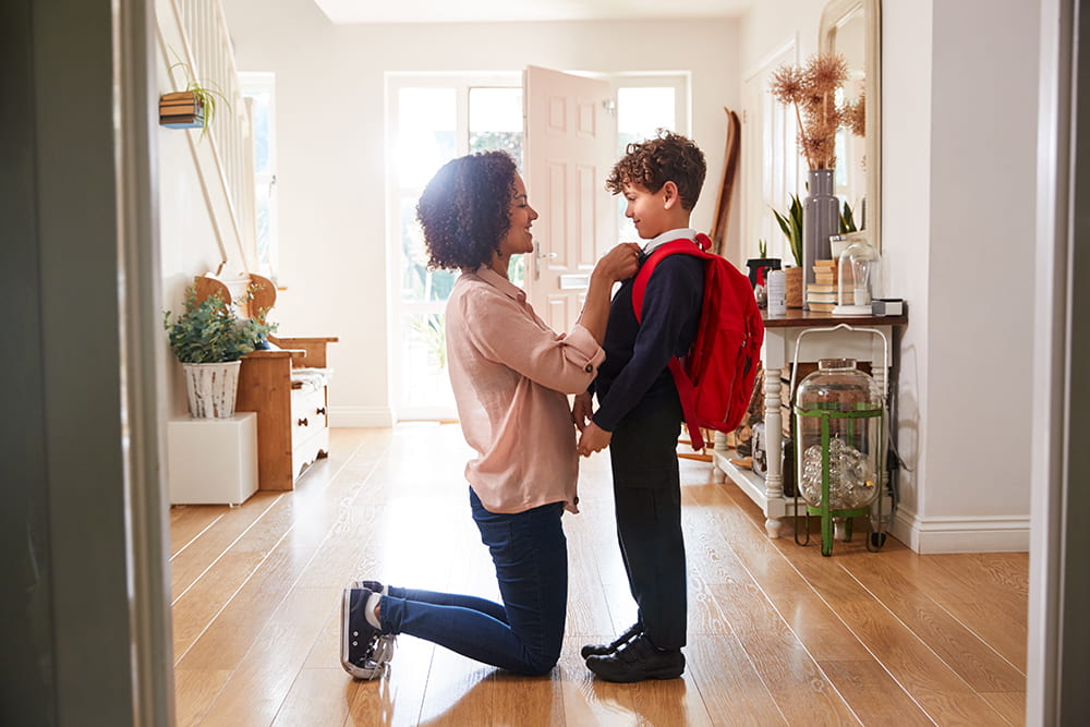 student and mother getting ready for school