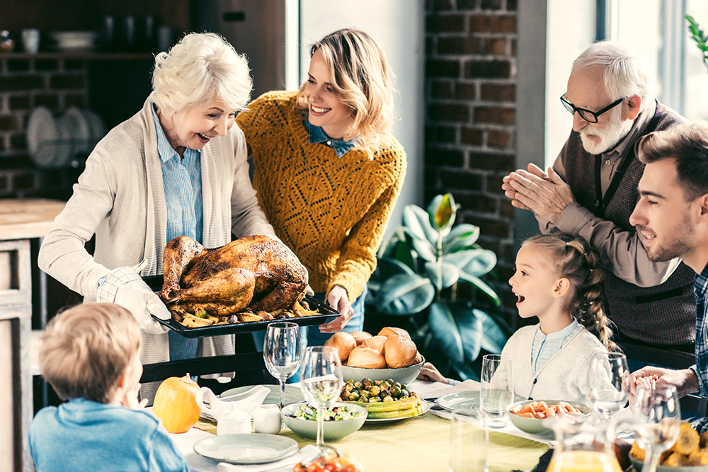 family at Thanksgiving dinner table