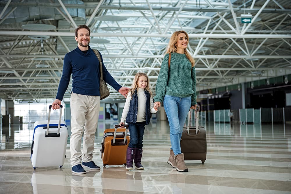 family walking through airport