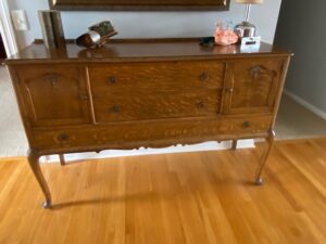 Solid cedar wood antique bureau styled in an entryway