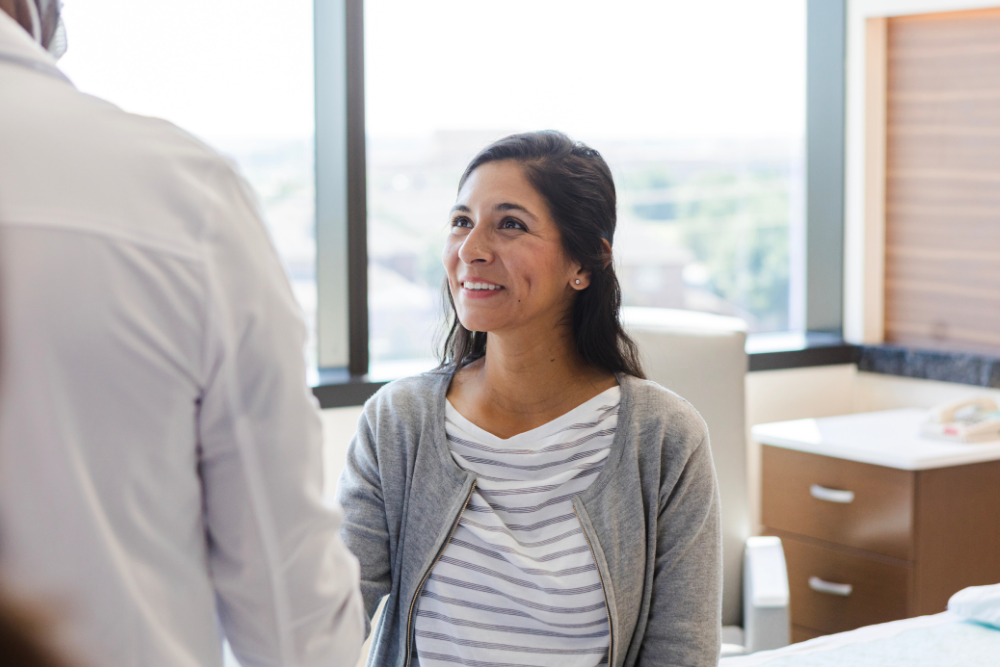 Woman smiling after seeing doctor