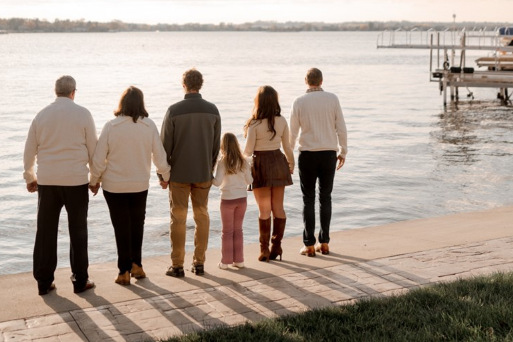 Ellen's family on a dock looking out over the water